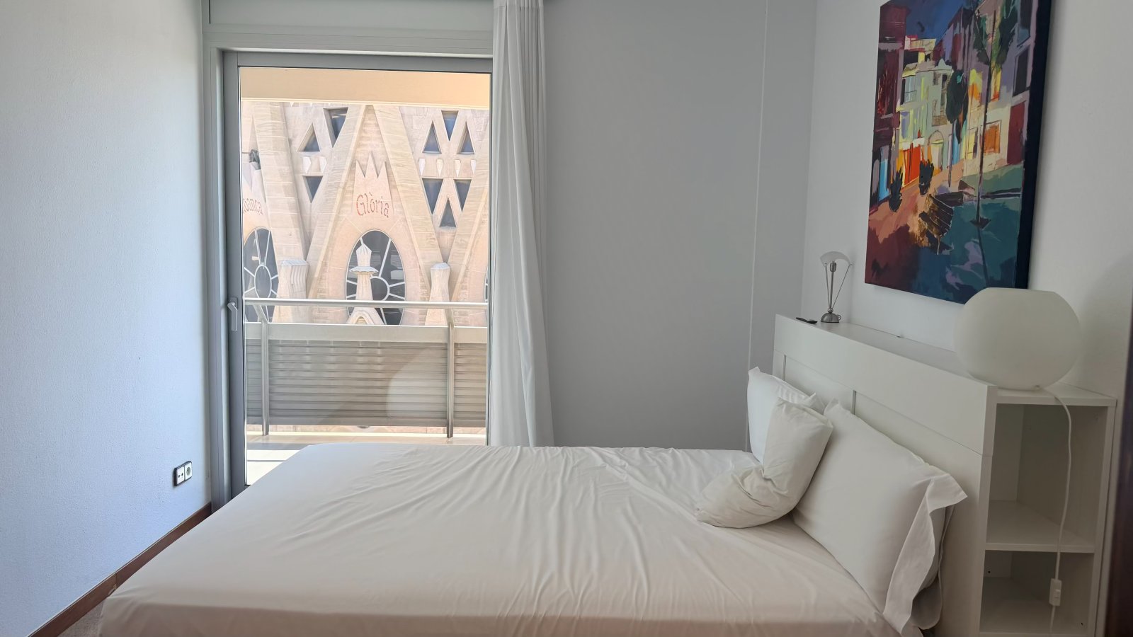 Master bedroom with the Sagrada Familia framed in the balcony doorway